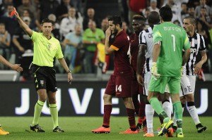 AS Roma's Manolas is shown a red card by referee Rocchi during their Italian Serie A soccer match against Juventus in Turin