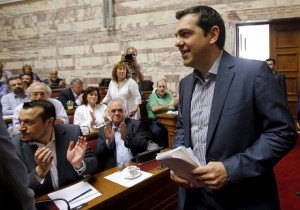 Greek Prime Minister Tsipras arrives for a session of ruling Syriza's leftist party parliamentary group at the Parliament building in Athens